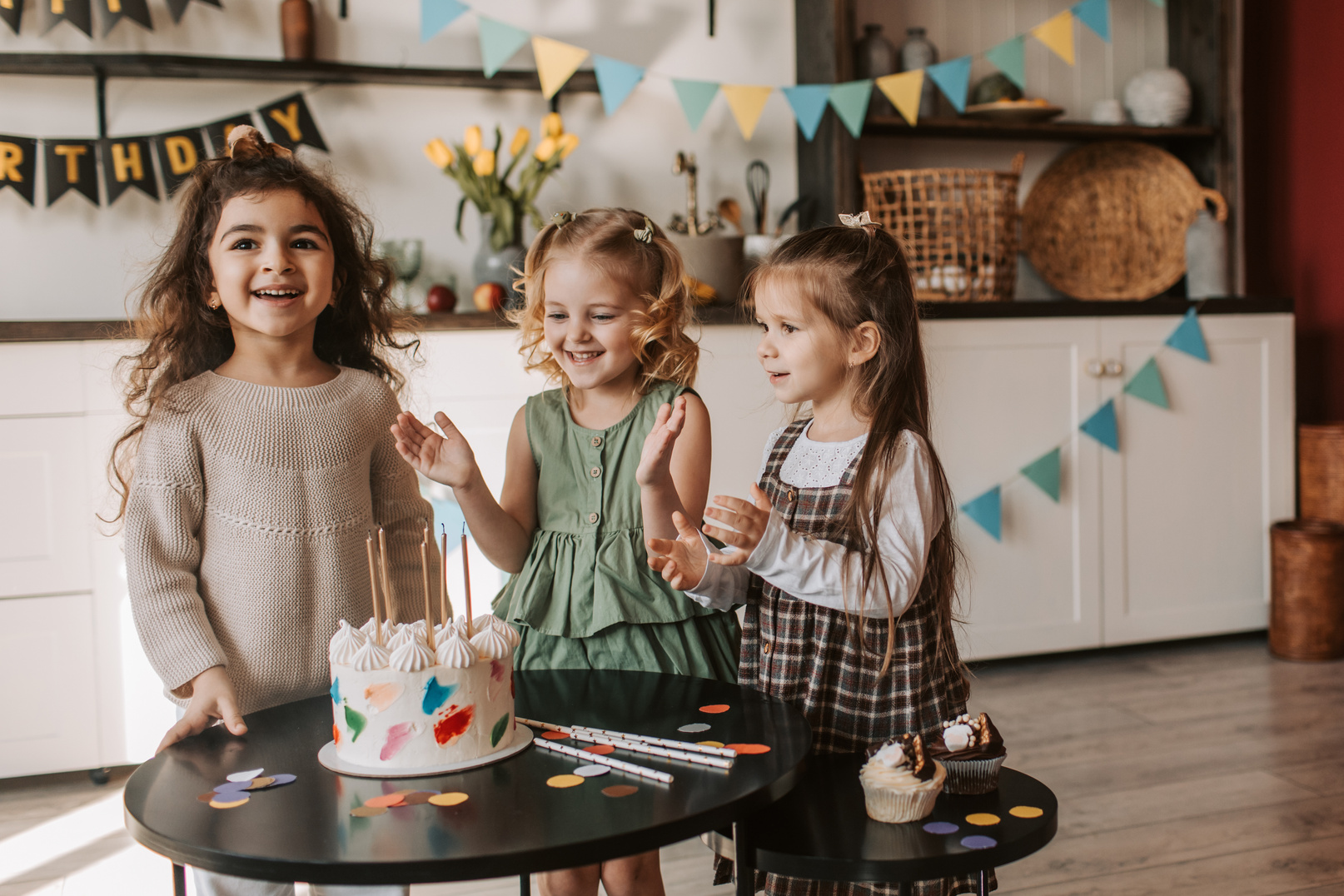 Girls Standing near Black Table Smiling