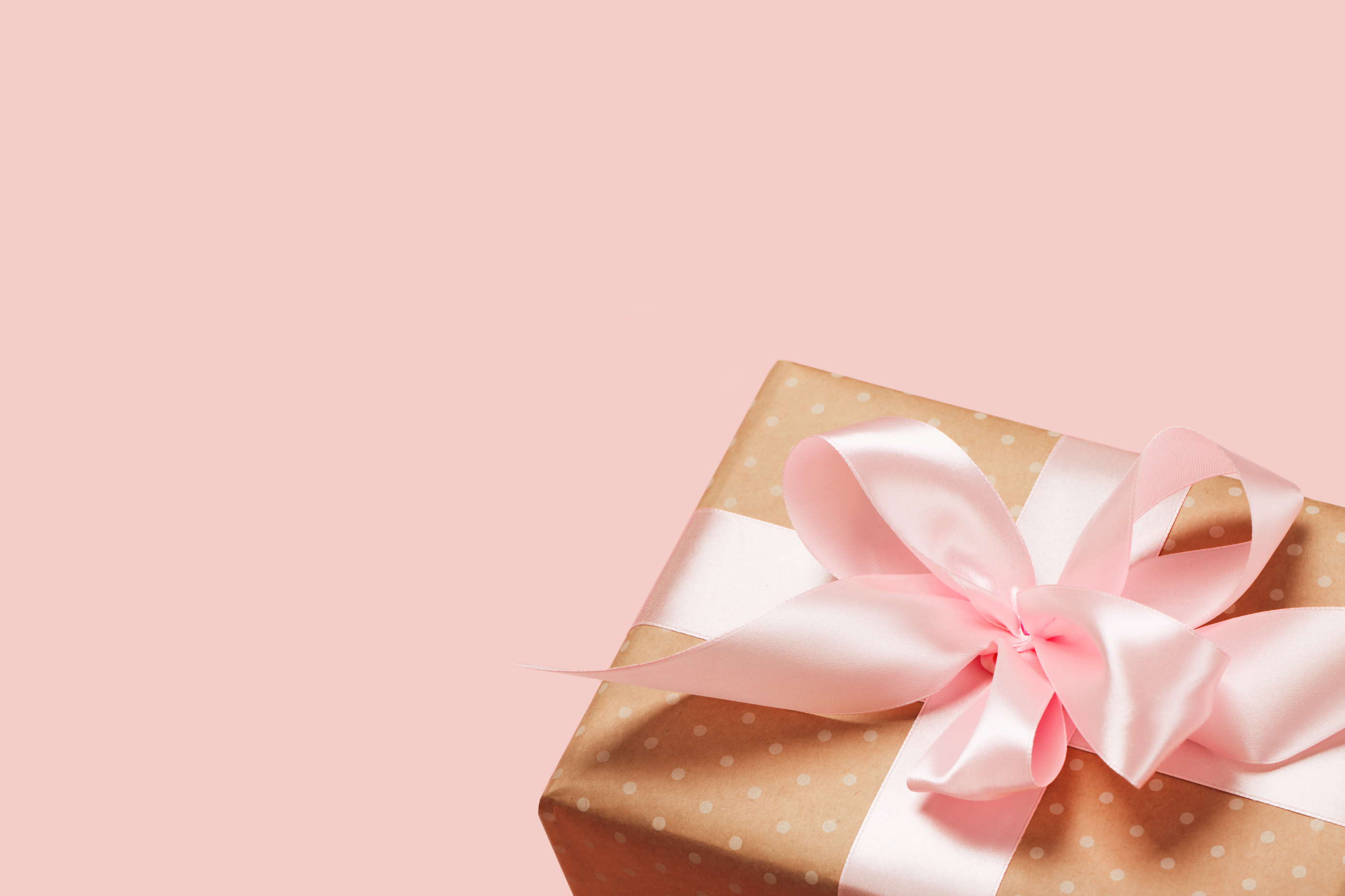 Luxurious gift on a fashionable pink background
